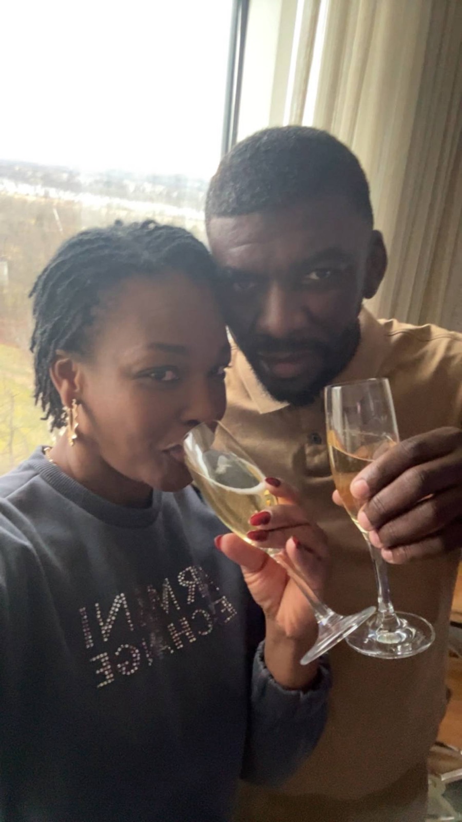 Sylvia and Edmund sharing a champagne toast
