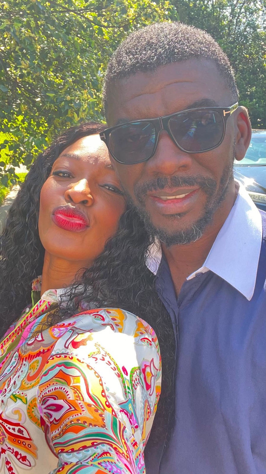 A close-up selfie of Sylvia and Edmund outdoors