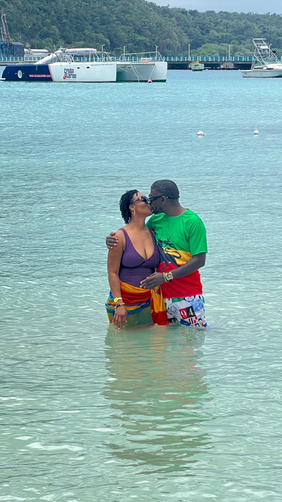 Edmund and Sylvia kissing in the sea