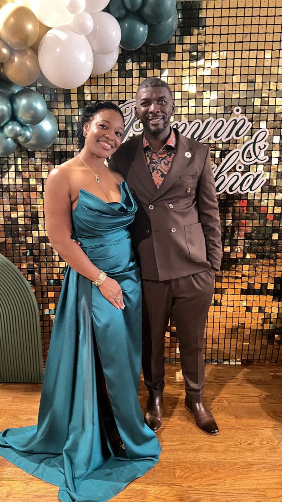 Sylvia in a teal gown beside Edmund at a celebration
